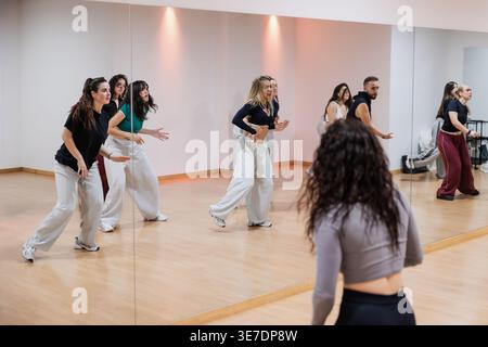 Group of dancers rehearsing choreography in studio Stock Photo