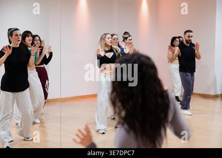 Group of young people dancing in a studio Stock Photo