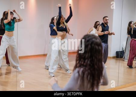 Diverse group of people practicing hip hop dance in studio Stock Photo