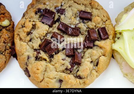 Mobile, Alabama, USA - April 2, 2026: A semi-sweet chocolate chunk cookie from Crumbl Cookies is pictured close-up on white in Mobile, Alabama. Stock Photo