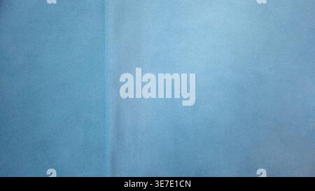 Minimal light blue fabric texture background with soft textile structure and subtle seam detail. Clean abstract backdrop suitable for design, branding Stock Photo