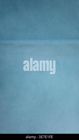 Minimal light blue fabric texture background with soft textile structure and subtle seam detail. Clean abstract backdrop suitable for design, branding Stock Photo