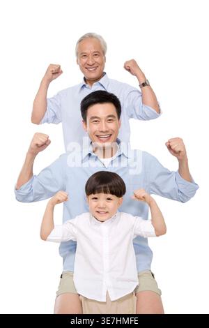 Smiling Chinese generation of males raising closed fists standing in a row against white background in studio Stock Photo