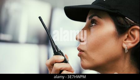 Security guard, woman and computer in control room, radio for video surveillance agency and talking. Employee, officer and person in workplace, pc and Stock Photo