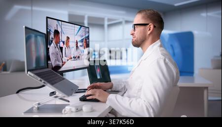 Doctor Provides Clear Treatment Guidance In Telemedicine Online Seminar Stock Photo