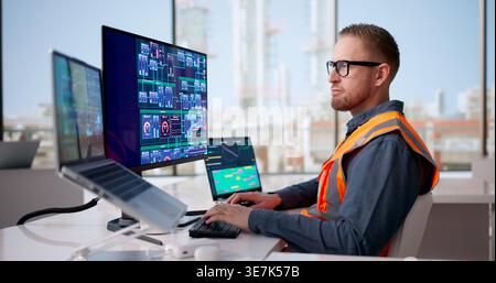 Industrial Engineer Oversees Automated Gas System With IoT And Computer Technology For Enhanced Safety And Efficiency Stock Photo
