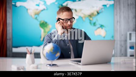 Global Business Attorney Engaged In Critical Phone Discussion On Cross-Border Trade Deals Stock Photo