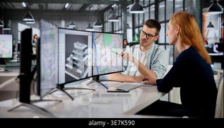Real Estate Appraiser Woman Uses GIS Mapping To Evaluate Urban Property. Stock Photo