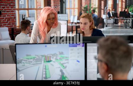 Urban Land Mapping Engineer Studies 3D City Data Using GIS Software. Stock Photo