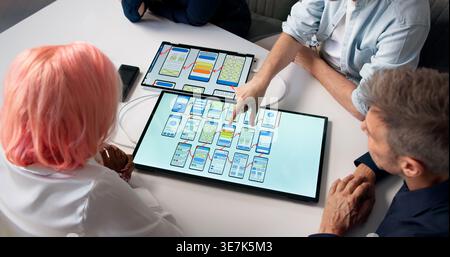 Web Designer And Developer Working With Team On User-friendly Website Interface. Stock Photo