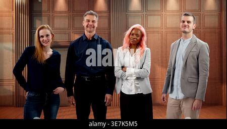 Lawyer Team Standing Confidently Together In Bright Modern Law Office Smiling. Stock Photo