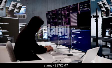 Young Hispanic Programmer Swiftly Typing On Laptop, Breaking Through Cybersecurity Defenses Stock Photo