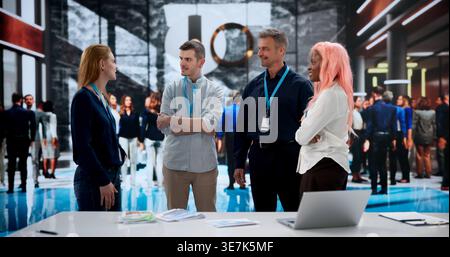 Marketing Manager Explains New Partnership Opportunities At Busy International Business Conference. Stock Photo