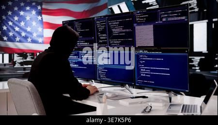 Cybersecurity Expert Coding Against American Flag Backdrop Stock Photo