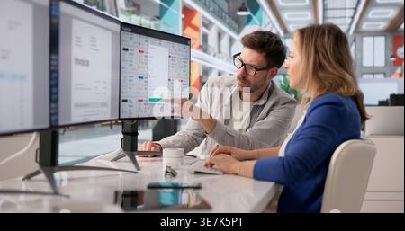 Archivist Systematically Managing Various Files On Computer For Cloud-Based Organization Stock Photo