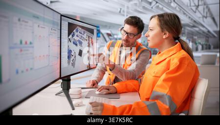 Engineers Collaborate On 3D CAD Factory Layout Optimization Using Advanced Software Stock Photo