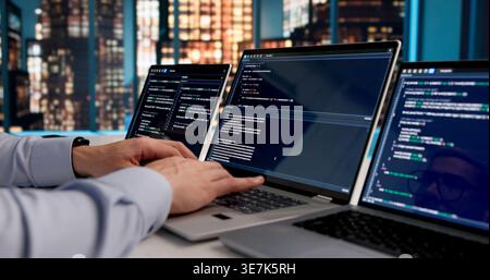 Dedicated Software Developer Immersed In Coding Web Applications At Office Desk Stock Photo