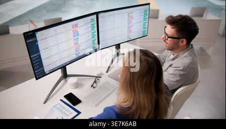 Analyzing Healthcare Data On Computers In A Training Workshop Stock Photo