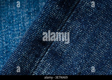 Detailed blue denim fabric texture background with visible stitching pattern Stock Photo