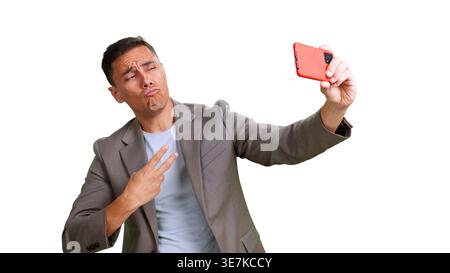 Young man making duck face with smartphone taking selfie Stock Photo