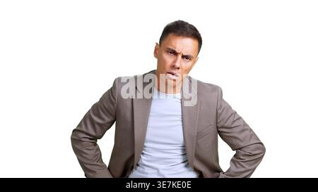 Businessman looking confused and frustrated, posing with hands on hips Stock Photo