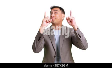 Man pointing up with index fingers suggesting looking up Stock Photo