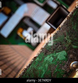 Close-up of scratched green painted surface with dirt and wear, showing textured decay. Stock Photo