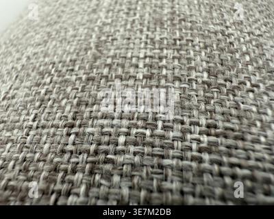 Textured fabric closeup showing woven pattern and fibers, suitable for backgrounds and materials. Mobile photo Stock Photo