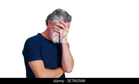 Senior man feeling stressed covering face with hand Stock Photo