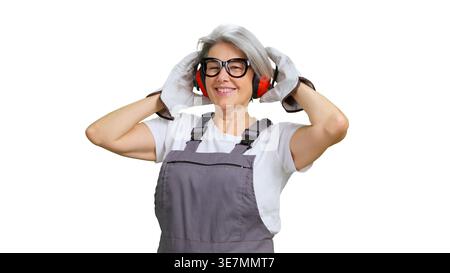 Mature woman worker wearing safety gear and smiling Stock Photo