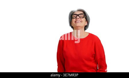 Smiling senior woman looking up with joy Stock Photo
