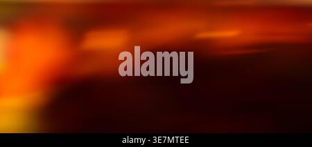 Dark red and orange dramatic abstract blurred gradient background with fiery warm tones and copy space Stock Photo