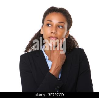 Serious Black business woman touching face looking away standing against white background Stock Photo
