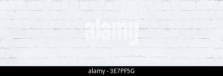 White painted concrete block wall. Whitewashed old brick texture. Light grunge panoramic background Stock Photo