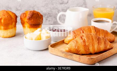 Hot coffee, croissants on a light background, selective focus. Breakfast concept Stock Photo