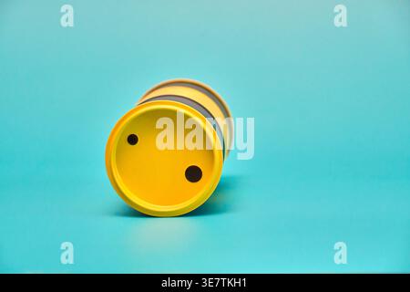 Yellow Cylinder on Blue Background - Minimalist Still Life Stock Photo