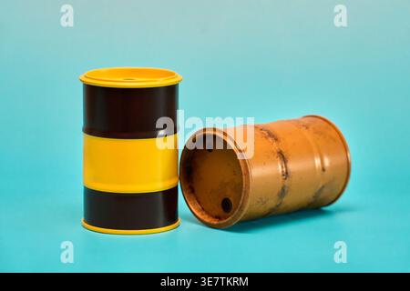 Two Empty Petroleum Drums on Blue Background Stock Photo