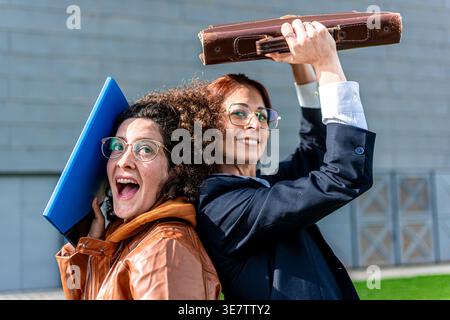 Successful businesswomen having fun together in office break Stock Photo