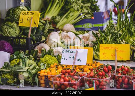 Fresh vegetables and fruit with prices in a farmer agricultural open air market, seasonal healthy food. Concept of biological, bio products, bio Stock Photo