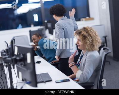 Diverse workmates having fun while working together in office Stock Photo