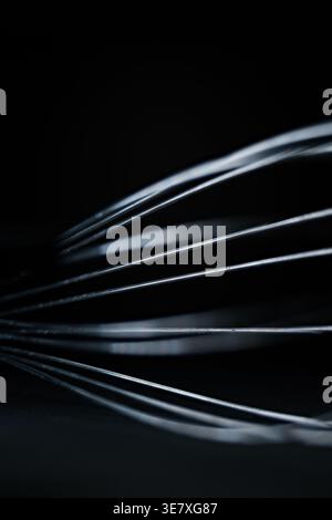 Abstract Macro of Stainless Steel Whisk Wires on Dark Background Stock Photo
