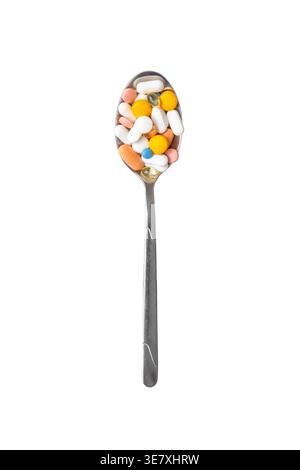 Spoon filled with different pills isolated on white background, pharmaceutical concept Stock Photo