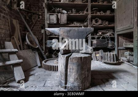Historic anvil in a abandoned workshop. Stock Photo