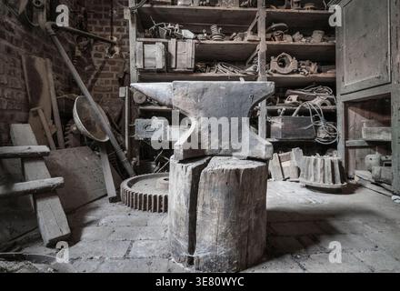 Historic anvil in a abandoned workshop. Stock Photo