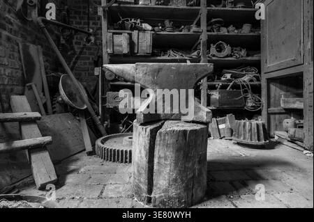 Historic anvil in a abandoned workshop. Stock Photo