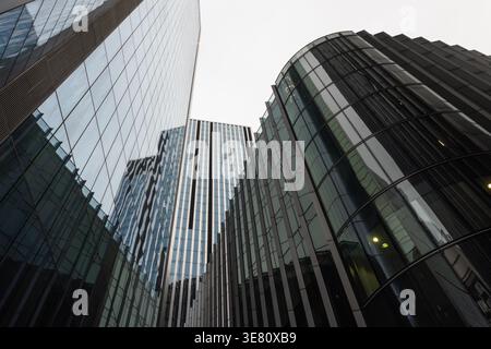 Modern urban architecture with curved glass facades in the city Stock Photo