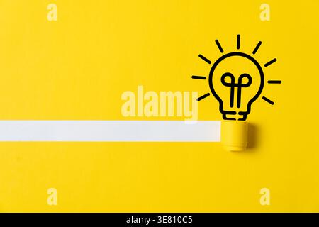 Minimalist concept image of a glowing lightbulb illustration on a vibrant yellow background with a blank white banner, symbolizing creativity, innovation, and new ideas. Stock Photo
