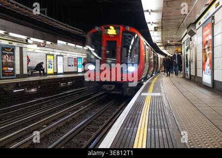 Blurred motion of a tube train in a London subway station. London, UK, 10 December 2023 Stock Photo