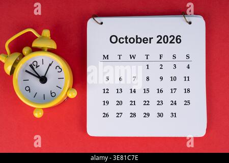 October 2026 desk calendar on red background Stock Photo