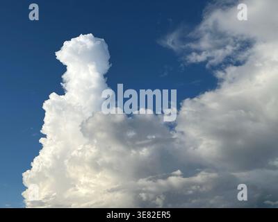 Cumulus cloud formation against a blue sky Stock Photo